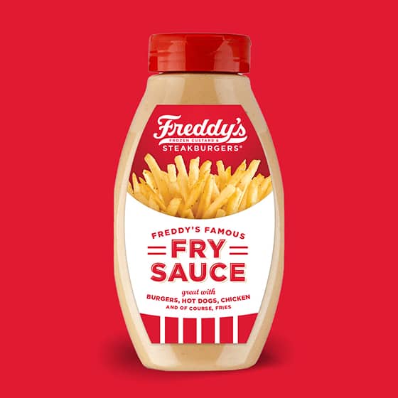 Freddy's Famous Fry Sauce bottle on vibrant red