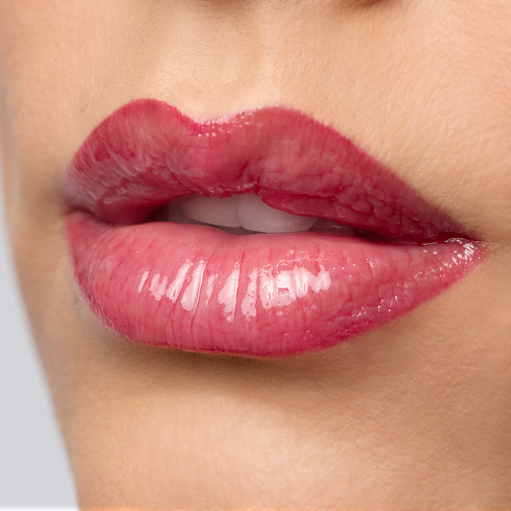 Supplied HRE Beauty glossy lip application macro photograph