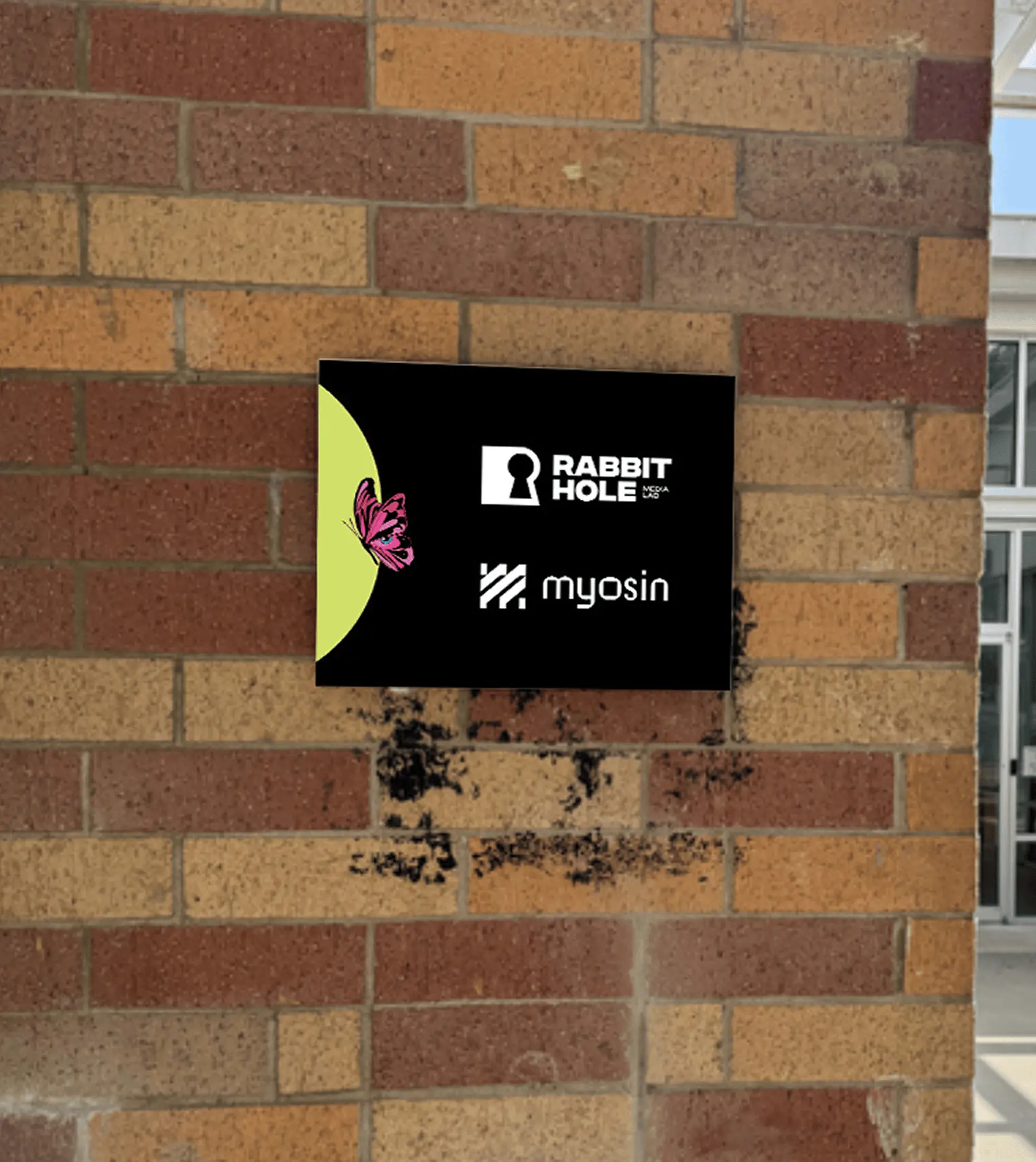 Rabbit Hole exterior brick building signage plaque