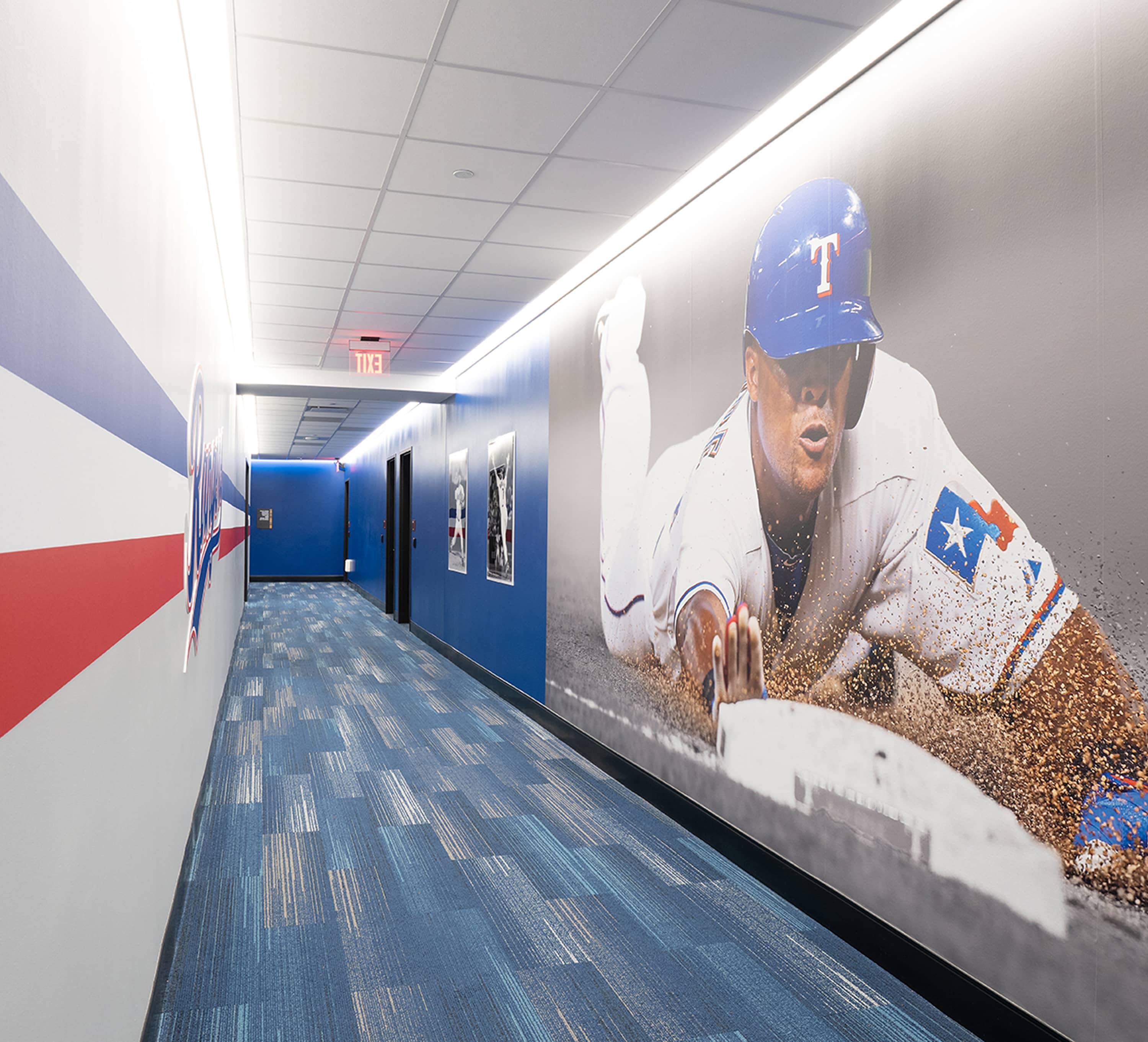 Full-height high-speed photograph of a headfirst slide lining corridor wall